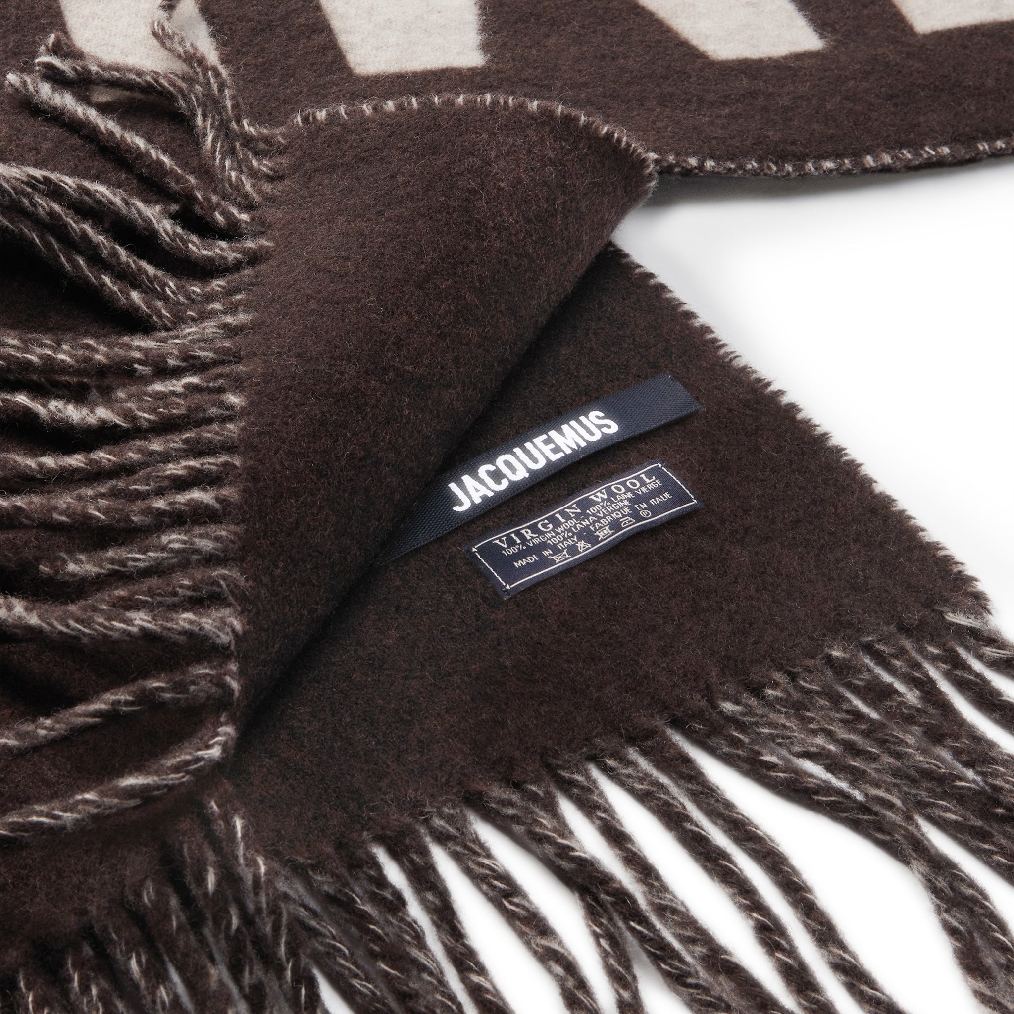Close up of Jacquemus L'echarpe Fringe Logo Multi-Brown Scarf